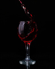 red wine pouring into glass