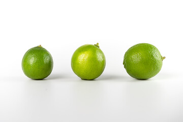 limes or lemons on white background