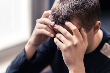 Shame, regret or despair. Sad lonely young man with depression or stress. Ashamed person in sorrow...