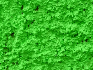 Concrete green plastered wall. Green salad grunge wall texture grunge background. Beautiful decorative green plastered rough wall or cyan painted stucco. Lime color texture as handmade rough paper