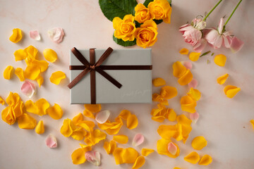 Yellow rose petal and gift box.