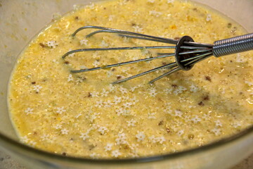 elderberry flowers trauma with yellow dough and sparkling spoon, elderberry flowers pancake making