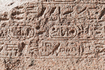  Stone wall with carved Egyptian hieroglyphs