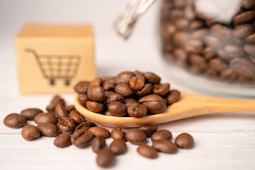 Box with shopping cart logo symbol on coffee beans, Import Export Shopping online or eCommerce delivery service store product shipping, trade, supplier concept.