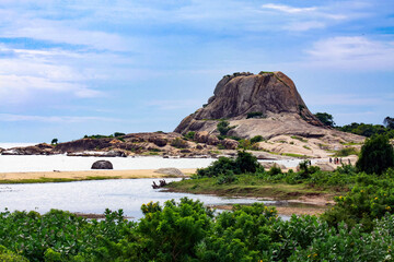 View over secluded lagoon sand beach on isolated rock on hill in tropical sea - Sri Lanka, Yala NP © Ralf