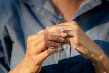 Sad Wife Take off the diamond wedding ring from finger. Quarrel fight of breakup Conflict, bad...