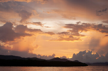 Beautiful and dramatic sunset behind mountains.