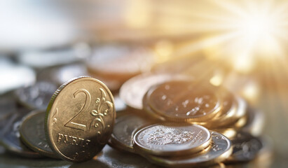 coins rubled in the rays of the sun background