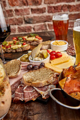 Picada Argentina to share with friends. Jamon Serrano, Chesse, tomatoes, hummus, olives.