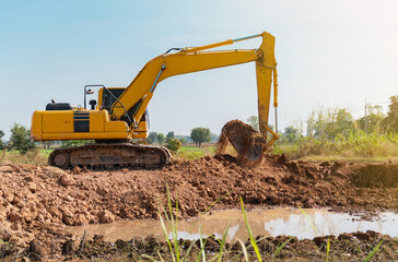 backhoe Dig the soil to make a pond.