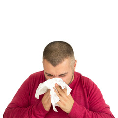 Young man holding handkerchief and sneezing isolated on white background