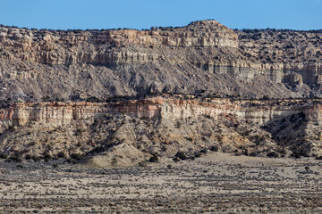 Fototapeta premium Closeup of rocky mountain range with interesting texture on clear day in rural New Mexico