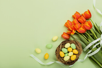 Stylish background with colorful easter eggs pastel colors isolated on green background. Flat lay, top view, mockup, overhead, template