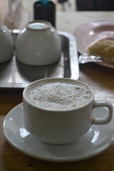 A cup of cappucino at traditional coffe shop in downtown Yangon, Myanmar.