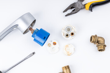 old clogged broken faucet cartridge. handyman repair leaky faucet. water tap fix service concept