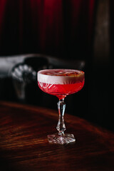 Beautiful wine glass, stands on the wooden floor