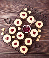 Heart shaped traditional linzer cookies with strawberry jam. Valentine s day concept.