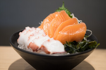 Sashimi bowl with salmon and octopus.