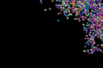 colorful star-shaped pieces on a black background