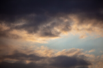 Rain clouds in the sky at sunset