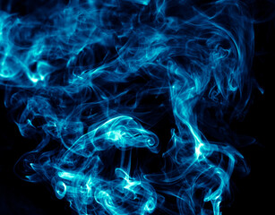 Obraz premium Blue smoke isolated on black background.