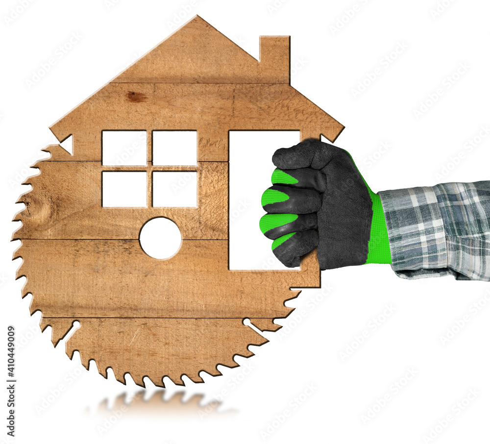 Poster carpenter with protective work gloves using an electric circular saw in the shape of a wooden model 