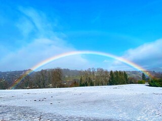 rainbow in the sky with snow landscapes 