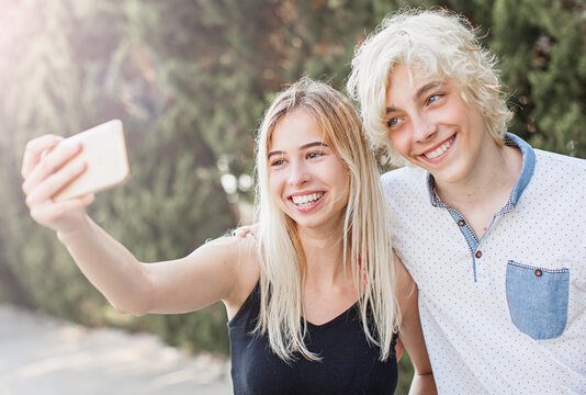 Young smiling couple taking a selfie portrait