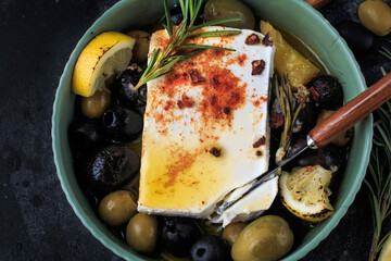 Baked Feta cheese with Lemon, Olives and Rosemary. 