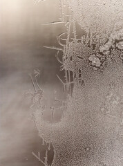 Patterns from frost on glass as a background.