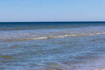 The background of sand with water splash into summer with space for text.