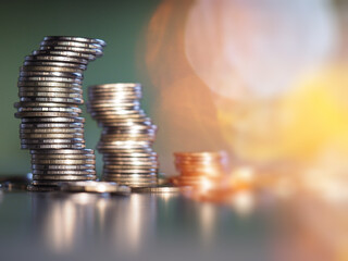 Close up of coins to stack of coins background
