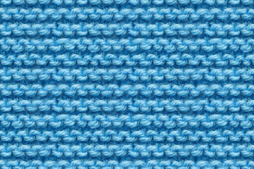 Blue Knitwear Fabric Texture. Machine Knitting Texture Macro Snapshot. Blue Knitted Background.