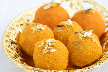 Special Banarasi Laddu Indian Mithai Made Of Bengal Gram Flour Deep Fried In Desi Ghee In Golden Tray. Meetha Laddoo Served On Festivals Like Holi Pooja Diwali Puja Eid Rakshabandhan And Weddings