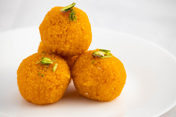 Special Banarasi Laddu Indian Mithai Made Of Bengal Gram Flour Deep Fried In Desi Ghee In White Plate. Meetha Laddoo Is Served On Festivals Like Holi Pooja Diwali Puja Eid Rakshabandhan And Weddings