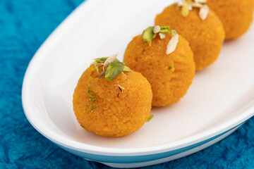 Special Banarasi Laddu Indian Mithai Made Of Bengal Gram Flour Deep Fried In Desi Ghee In White Tray. Meetha Laddoo Served On Festivals Like Holi Pooja Diwali Puja Eid Rakshabandhan And Weddings