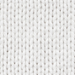 White knitted fabric seamless pattern for borderless fill. Knitted fabric repeating pattern for background close up.