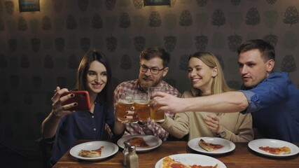 Happy people in pub eat pizza and talk by videocall with friends.
