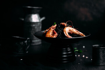 Black pasta with tiger prawns