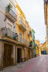 Fototapeta na wymiar Castellón de la Plana, Valencian Community, Spain. Beautiful historical colorful spanish empty street. Shot during the Coronavirus (Covid-19) pandemic. No tourists.