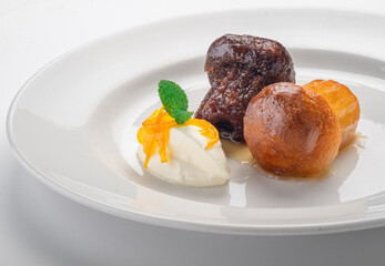 Italian dessert baba from Naples on plate isolated on white, close up