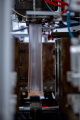 Preforms for making PET plastic bottles. Blank for production of containers for milk or beer. Line factory industry equipment