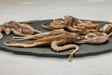 Obraz premium fresh octopuses on a light background 