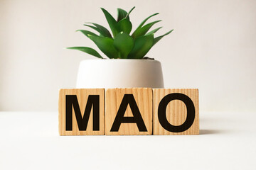 word MAO on wooden blocks. medical concept . the medicine