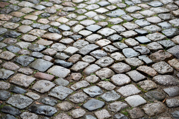 Closeup of ancient cobbles on the floor in the street