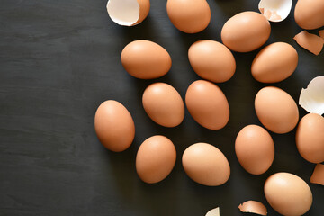 Eggs arranged in a black wooden background.