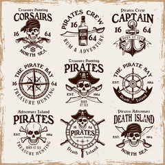 Fototapeta premium Pirates set of vector emblems, labels, badges or logos in vintage style on background with removable grunge textures