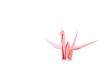 A pink origami paper bird