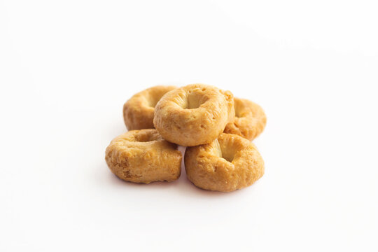 Traditional italian tarallini snack from wheat dough isolated on white background