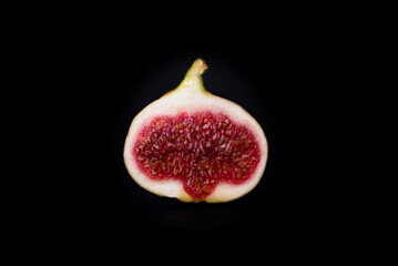 Tasty figs on a black background. Top view.